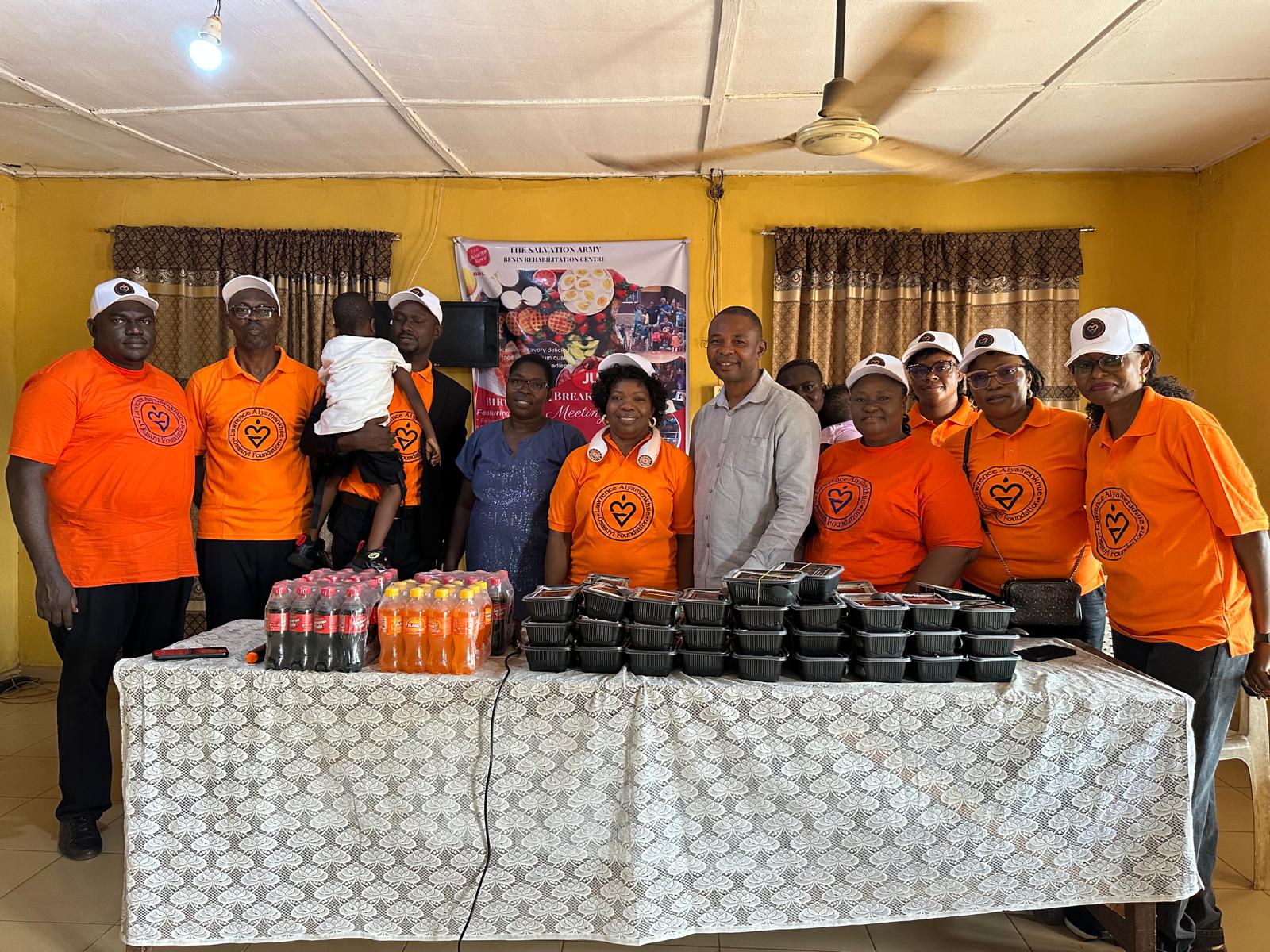 LAOF volunteers gathered behind a table of donated supplies