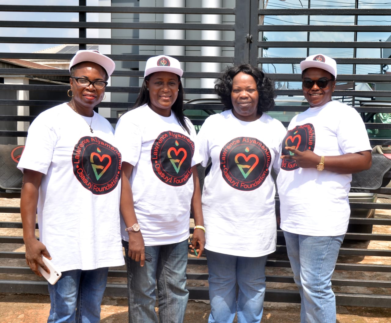 LAOF team members standing together in branded white shirts