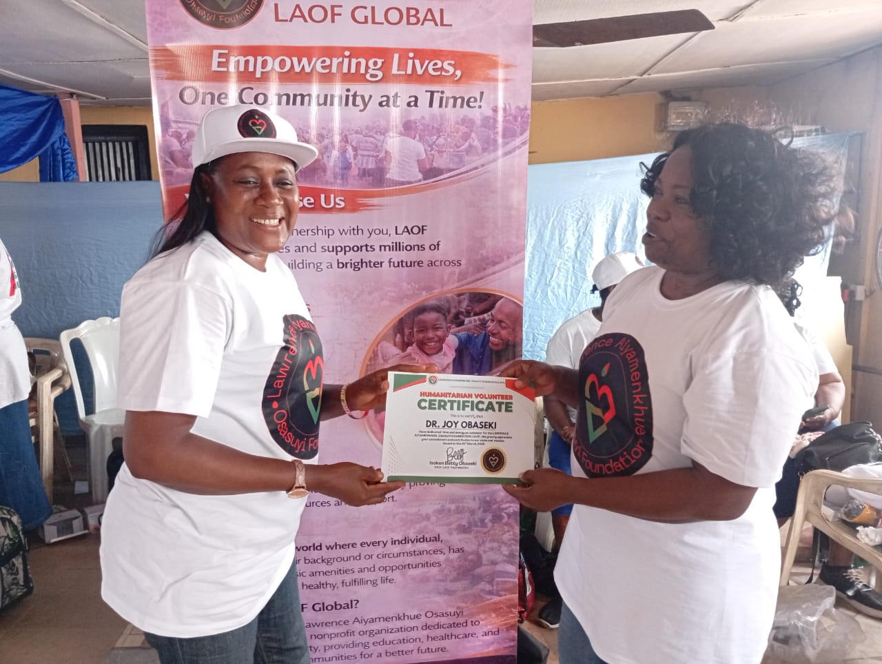 LAOF volunteers presenting a document to an outreach participant