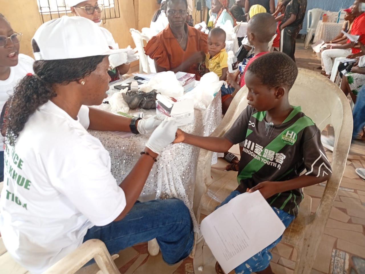 A participant receiving a health check from a LAOF volunteer