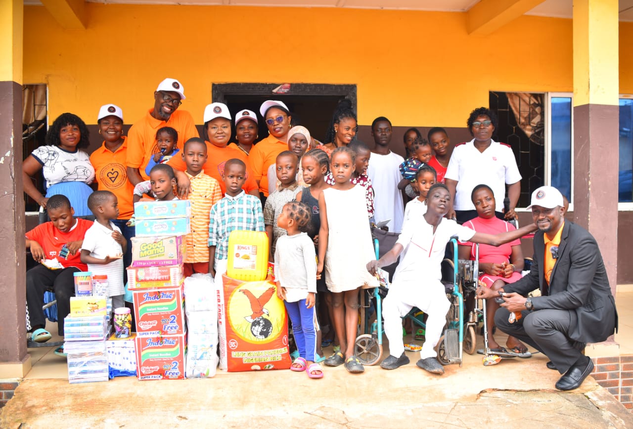 LAOF volunteers and children gathered at an outreach event