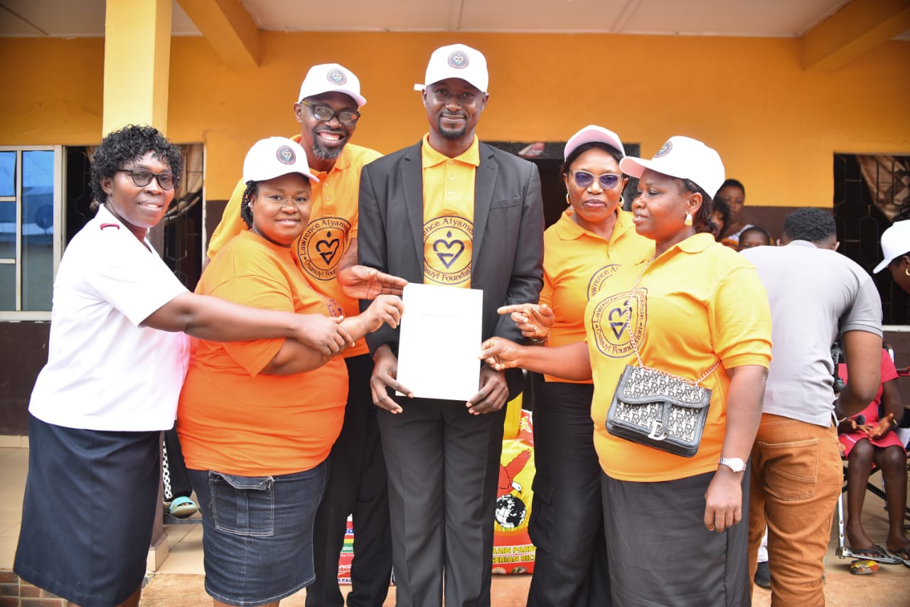 LAOF volunteers presenting a document during an outreach visit