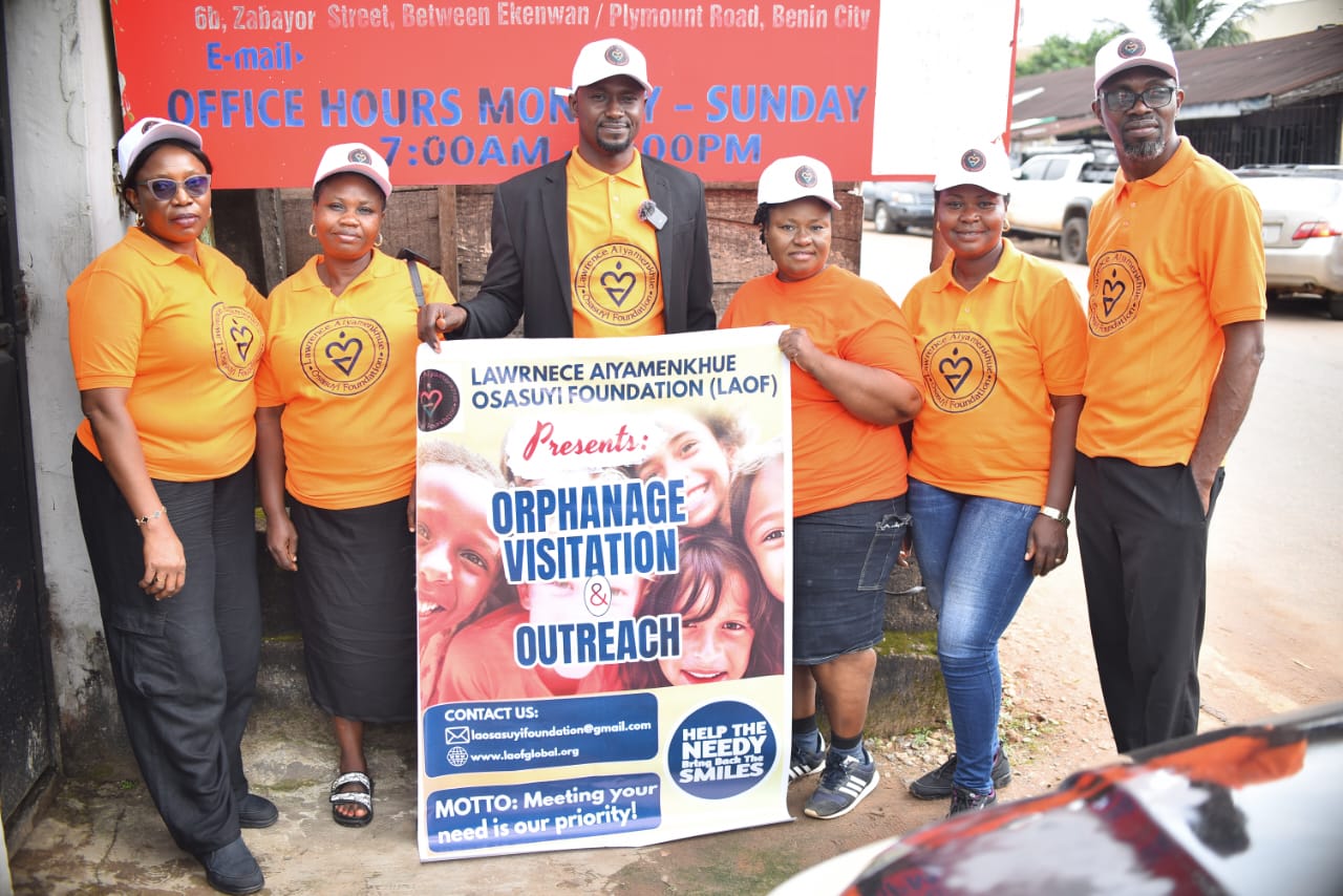 LAOF team with an outreach banner and supplies
