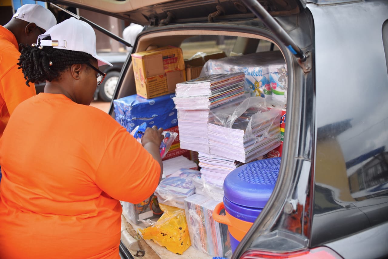 LAOF volunteer unloading boxes of outreach supplies from a vehicle