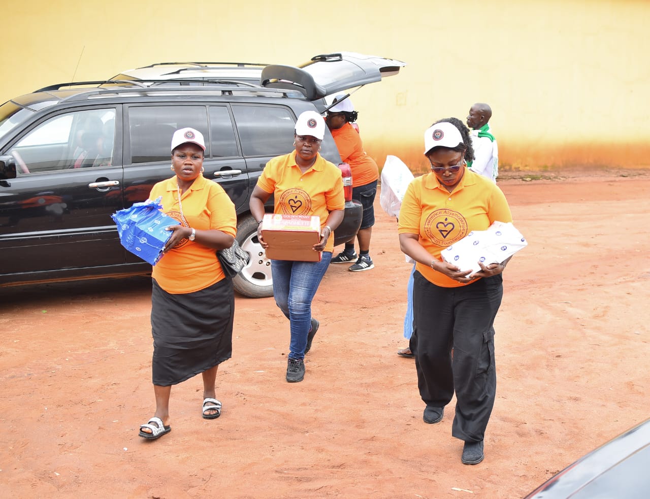 LAOF volunteers carrying supplies outdoors