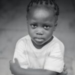 Child in Nigeria Folding Hands